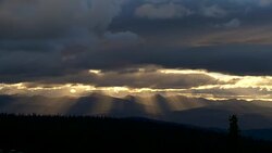 SUNBURST IN THE MOUNTAINS AND FOREST Stock Footage