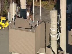 MS AERIAL ZO DS Shot of Olympic Ski Jumps at Placid lake / New York, United States Stock Footage