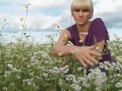 HD DOLLY: Young Woman Caressing Buckwheat Flowers Stock Footage