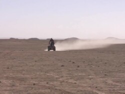 Riding a quad-bike Stock Footage