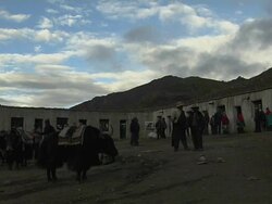 Wide Block Shot People at Zuzulpuk Lhasa Tibet China Stock Footage