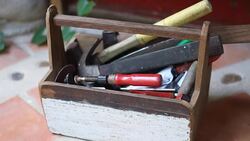 Grab the tools from the wooden toolbox Stock Footage