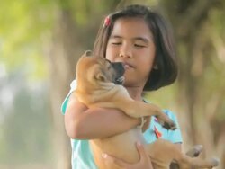 girls and puppy in the garden Stock Footage
