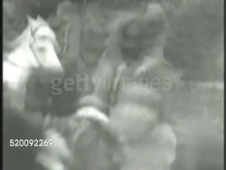 1948: GREECE GUERRILLA CHIEF: * VS KKE (Communist Party) leader Markos Vafiadis (1906-1992) riding horse into camp, dismounting. VS Vafiadis shaking hands w/ Greek officers. CU Vafiadis talking. WS Vafiadis & officers entering house. Cold, Civil War Instructional Video