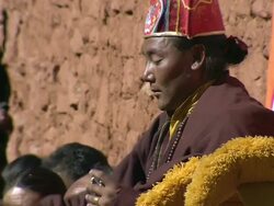 WS View of People at saldang gompa tibetan buddhist monastery and surrounding dry arid mountains / Saldang village, High Himalayas, Upper Dolpo near Tibetan border, Nepal   Stock Footage