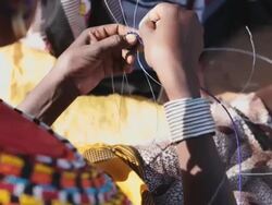 Samburu woman threading beads Stock Footage