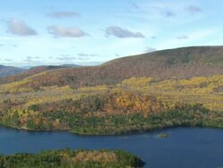WS ARIEAL ZI View of Lake around forest /Maine, United States Stock Footage