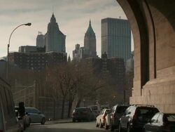 A slow reveal of a small road underneath the Manhattan Bridge Stock Footage