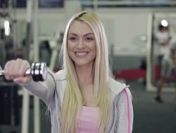 Young woman Working With Weights In Gym Stock Footage