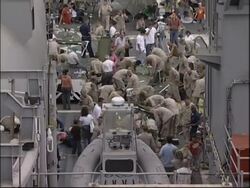 WRAP Navy ship docks with more than 1000 US evacuees, adds reax News Clip
