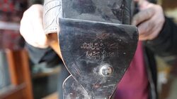 CLEAN : A decade later Saddam lives on in Baghdad shop News Clip