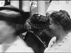 1920: SUMMER PRESIDENTIAL CAMPAIGN: VS Crowd & parade in front of Senator Warren G. Harding's home. MS Florence Harding, an unidentified woman & husband Warren in outdoor receiving line shaking women's hands, elder male w/ hand to ear. Instructional Video
