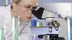 Scientist, doctor, student, using microscope in laboratory Stock Footage