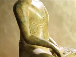MS TU SLO MO Rotating buddha statue carved in stone against of gold background / Miami, Florida, United States Stock Footage