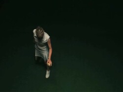 SLO MO WS HA Studio shot of woman serving tennis ball Stock Footage