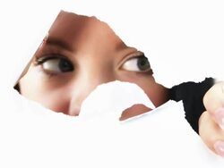 Woman Looking Through Torn Paper Stock Footage