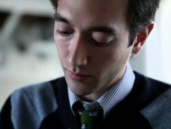 CU PAN TD Businessman sitting at office conference table writing on notepad/Seattle, Washington, USA Stock Footage