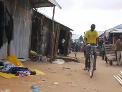 POV walking through village street scene Stock Footage