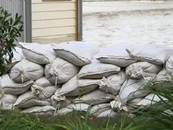 May 9, 2011 Mississippi River Flooding Sandbags stacked up to protect dwellings on Mud Island, Memphis, Tennessee, USA Stock Footage