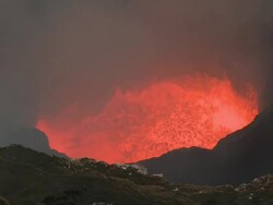Wide shot of volcanic gas and lava in crater, Marum Volcano, Ambrym Island, Vanuatu Stock Footage
