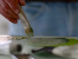 CU Man mixing paint on table / Hudson, New York, United States Stock Footage