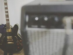View on amplifier knobs, plugs and electric guitar Stock Footage
