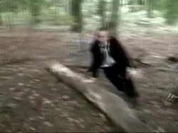 Business man alone murdered by creature in dark forest Stock Footage