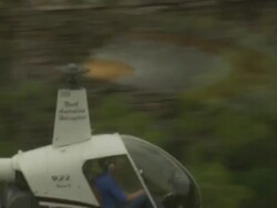 Helicopter in flight through canyon, Kakadu National Park, Australia Stock Footage