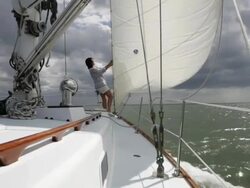 TS woman on bow of yacht in stormy weather /tampa,florida,US Stock Footage
