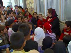 MS ZO Shukria talking to students at daycare center / Kabul, Kabul Province, Afghanistan Stock Footage