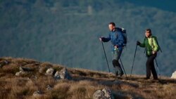 Couple walking on the top of the plateau Stock Footage