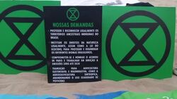 CLEAN : Extinction Rebellion stages a protest for climate justice in Rio News Clip