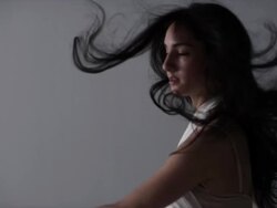 portrait of woman dancing with her hair floating around her Stock Footage