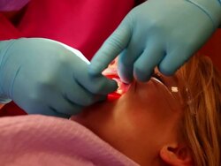 MS Young girl sitting in dentist chair / Lamy, New Mexico, United States Stock Footage