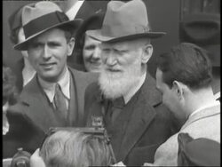 Playwright George Bernard Shaw talks to reporters. News Clip