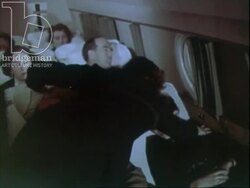 Young lady sleeps on a plane, wakes up and looks out window, c.1960 Stock Footage