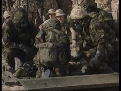 UK troops practise NBC suit drills News Clip