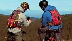 LD Male bikers checking the trail on a mobile Stock Footage