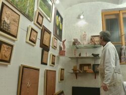 HD DOLLY: Artist Proudly Looking His Gallery Stock Footage