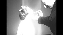 British doctor examining children in London for evacuation to US during World War II News Clip