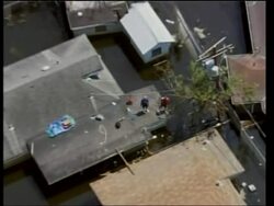 Dramatic pix of rescue &amp; recovery, flood waters News Clip