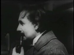 B/W 1920s PROFILE close up young Albert Einstein smoking pipe + smiling Stock Footage