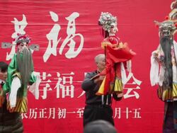 MS Chinese artists performing puppet show at temple fair to celebrate Chinese spring festival AUDIO / xi'an, shaanxi, china Stock Footage