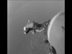 SYND 02-02-69 Wedding guests parachute into ceremony News Clip