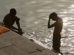 MS Two boys bathing in Gangas River / Varanasi, Uttar Pradesh, India Stock Footage