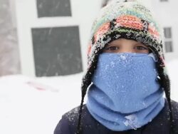 CU Boy wearing warm clothing during snowstorm / Yarmouth, Maine, USA Stock Footage