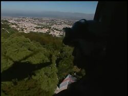 U.S. Military personnel are starting to distribute boxes of water bottles to Haitians in need.  An AP camera rides with their helicopter. News Clip