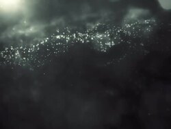 Defocused White / Silver Particles (Dark) - loopable Stock Footage