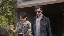 Group of friends carrying coffee find a table outside of caf_ Stock Footage