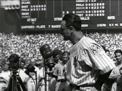 B/W 1939 PROFILE solemn Lou Gehrig making farewell speech in crowded stadium Stock Footage